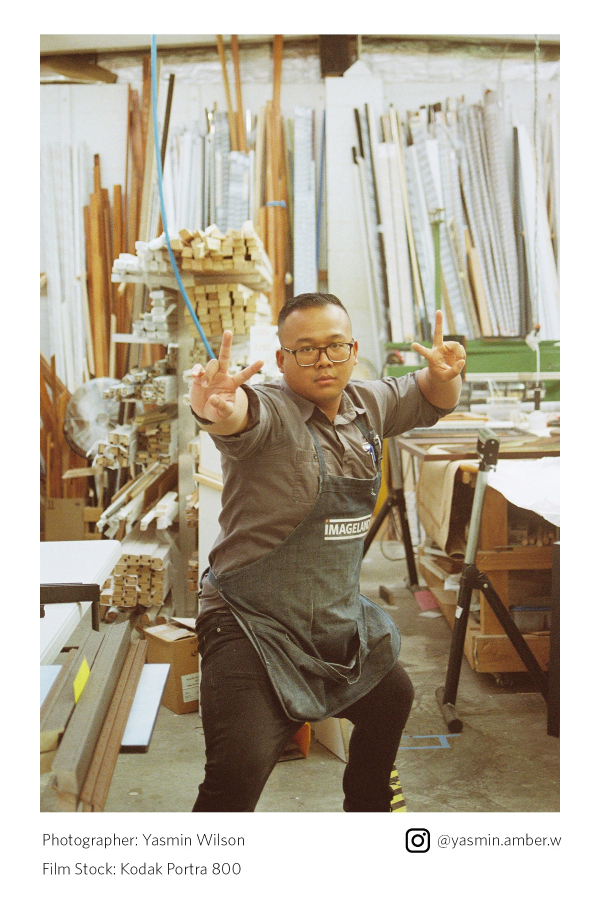 Man in a workshop making peace signs with his hands