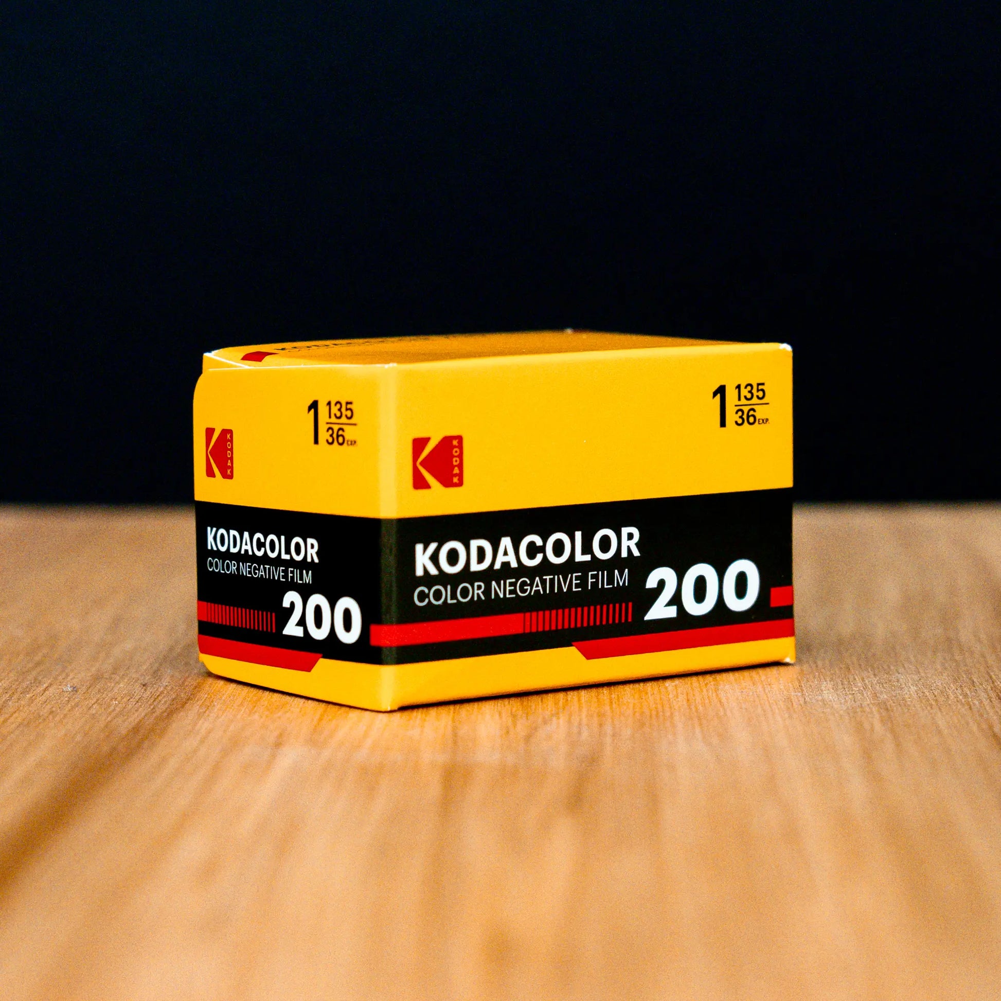 Kodak KODACOLOR Color Negative Film 200 box on a wooden surface with a black background