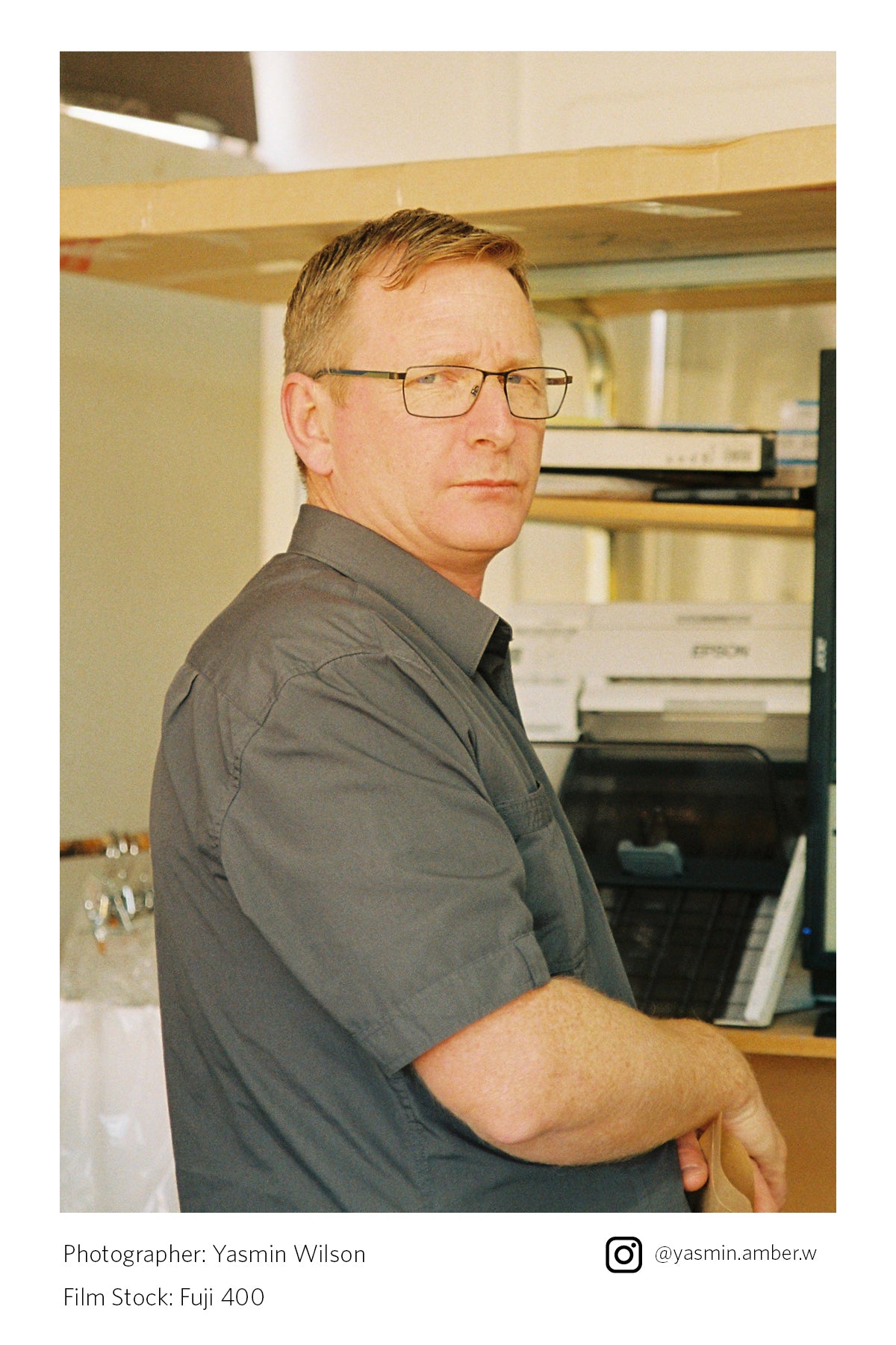 a Lance standing in front of a computer